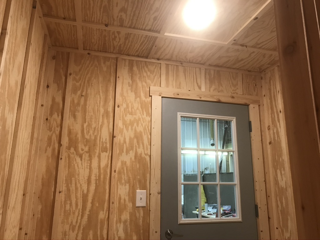 pine board and batt on walls with pine door trim