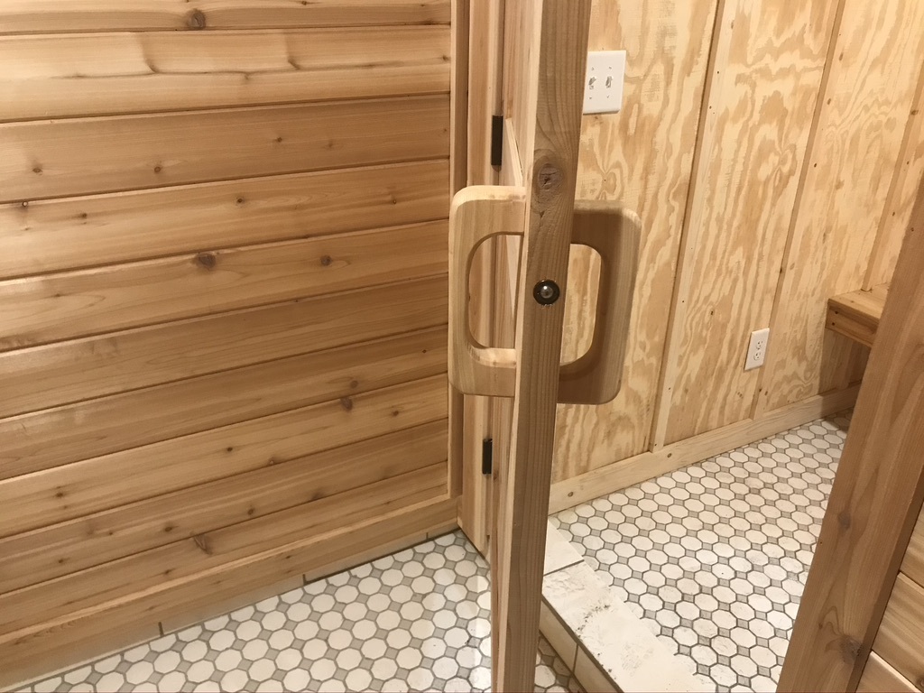 Hand made cedar door handles and a ball catch for door latch