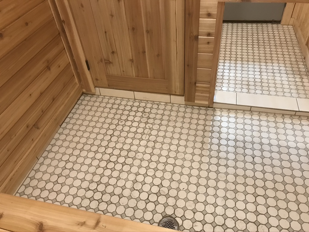 Tile curb below door to sauna